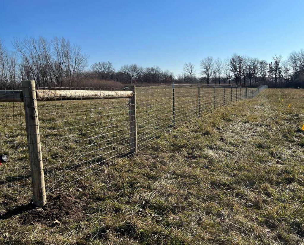 Agricultural fencing installed around a pasture