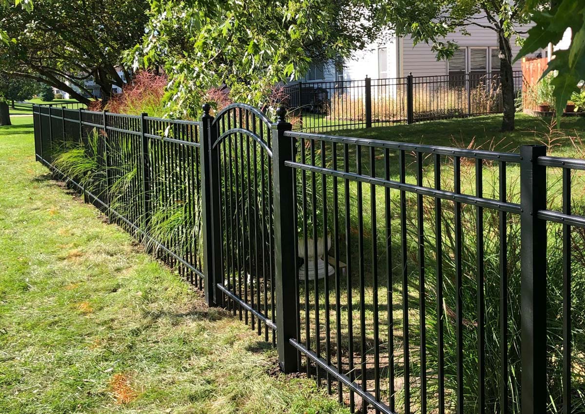 Wrought iron fence with gate, fencing in backyard