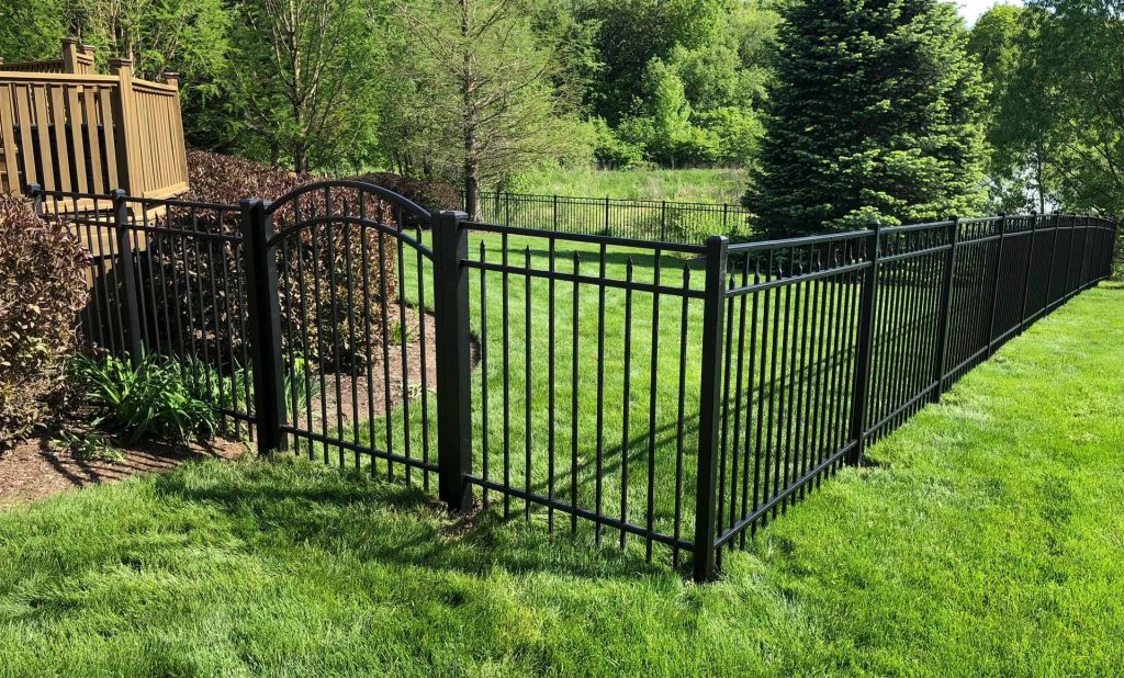 Aluminum fence with gate, fencing in a backyard