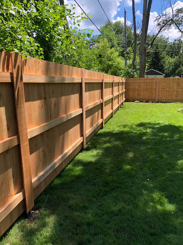 Photo of wooden privacy fence from interior of a yard