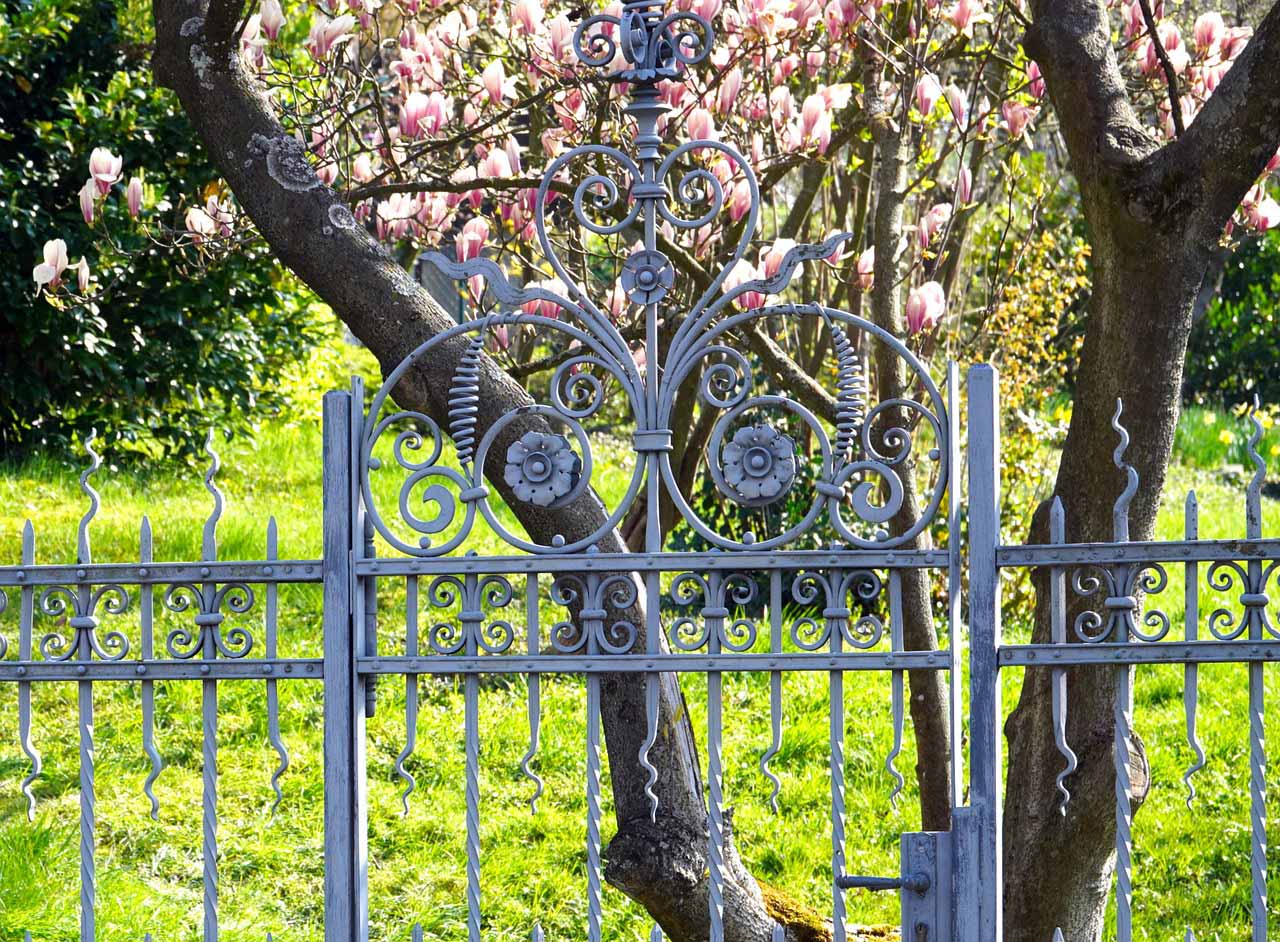Gate on wrought iron fence